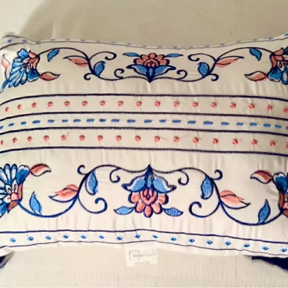 Mainstays Throw Pillow White w Blue/Pink Embroidery Approximately 16”x12”.